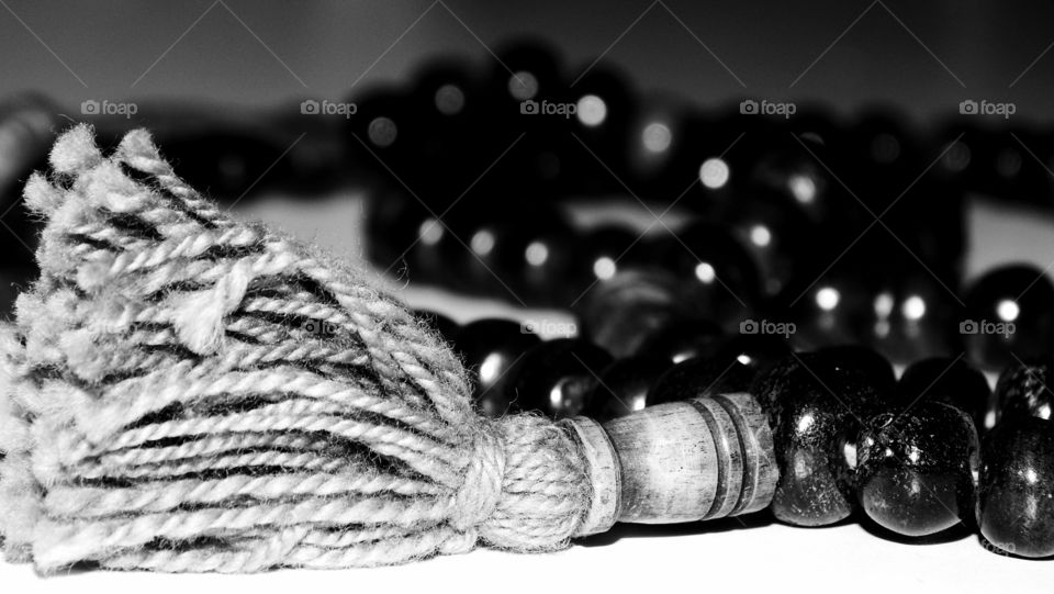 macro shot of a japamala of tibet 

 monochromatic