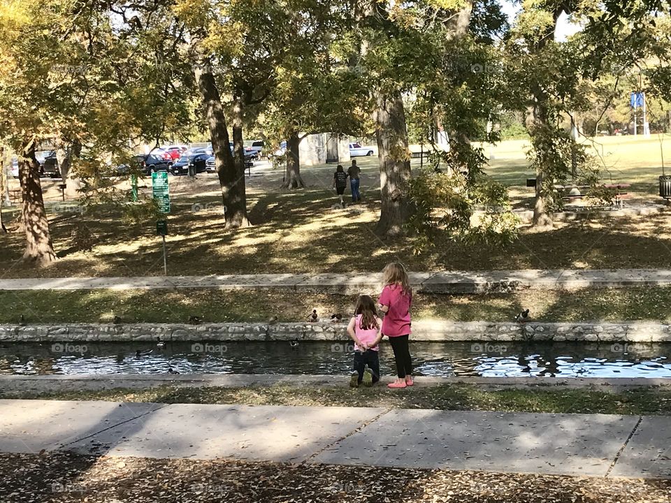 Girls watching the ducks 