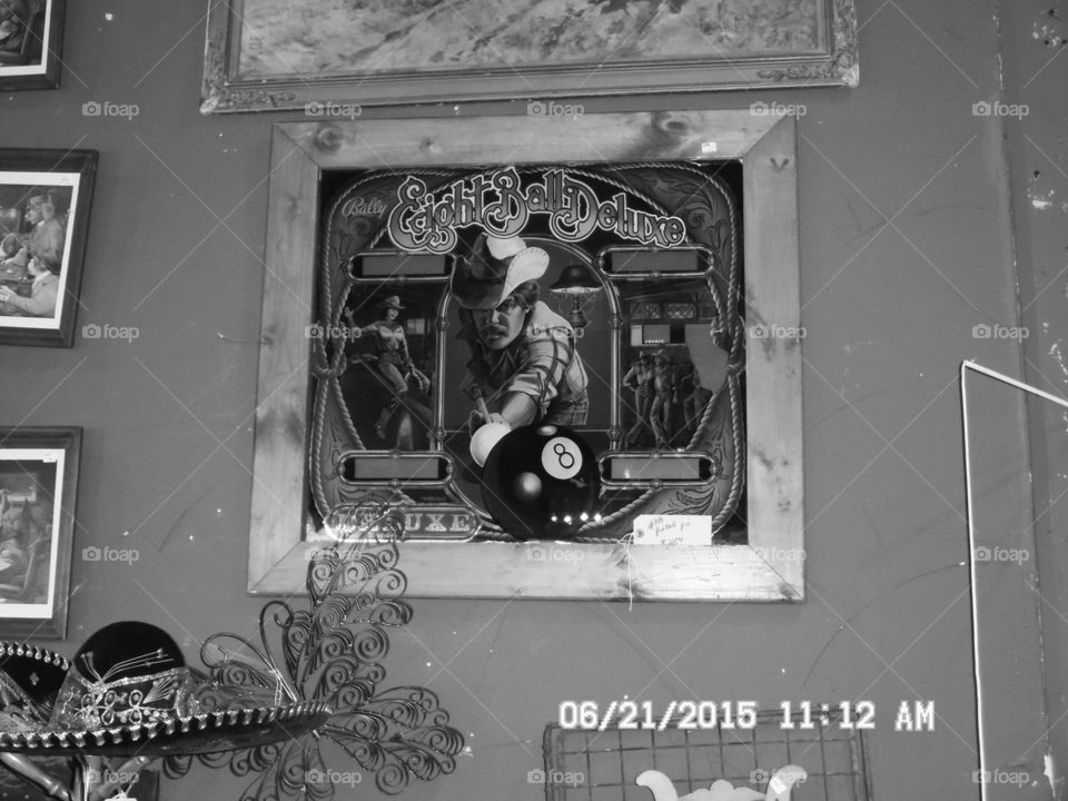 eight ball  shooter . this is a picture of some artwork that I saw in a gift shop in Weatherford Texas 