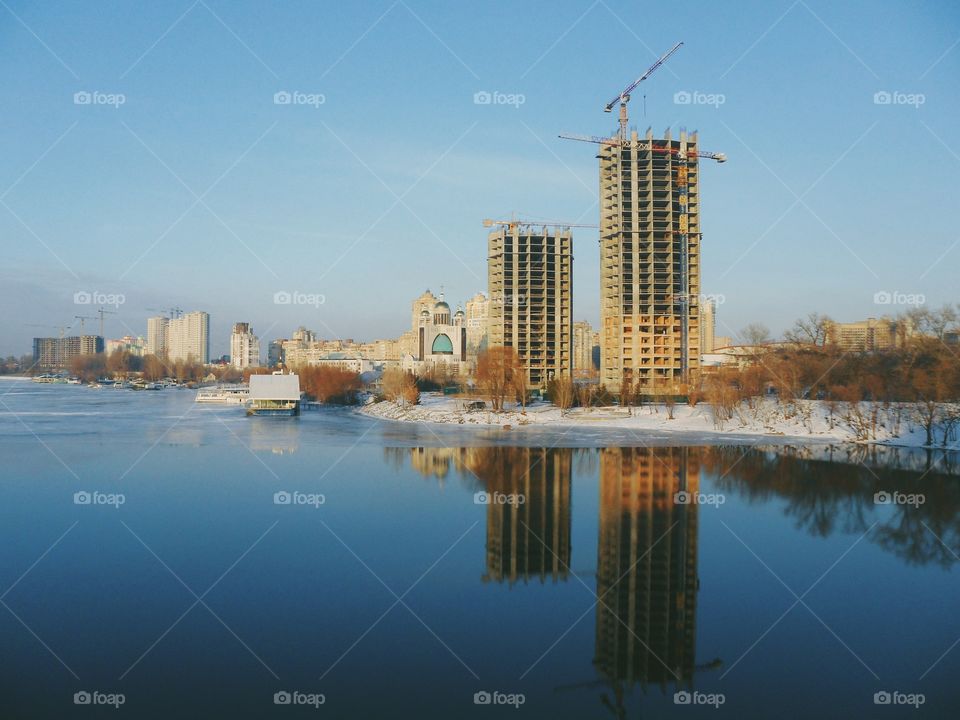 an incredible reflection of buildings in the river Dnepr