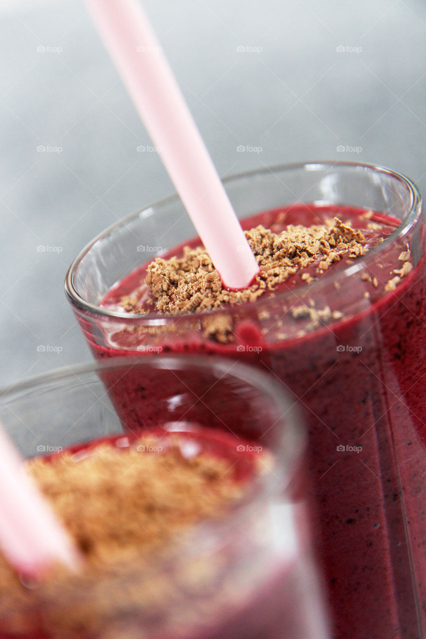 Raspberry smoothies with straws