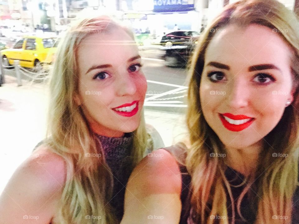 Sisters with red lips. My sister and I in Tokyo