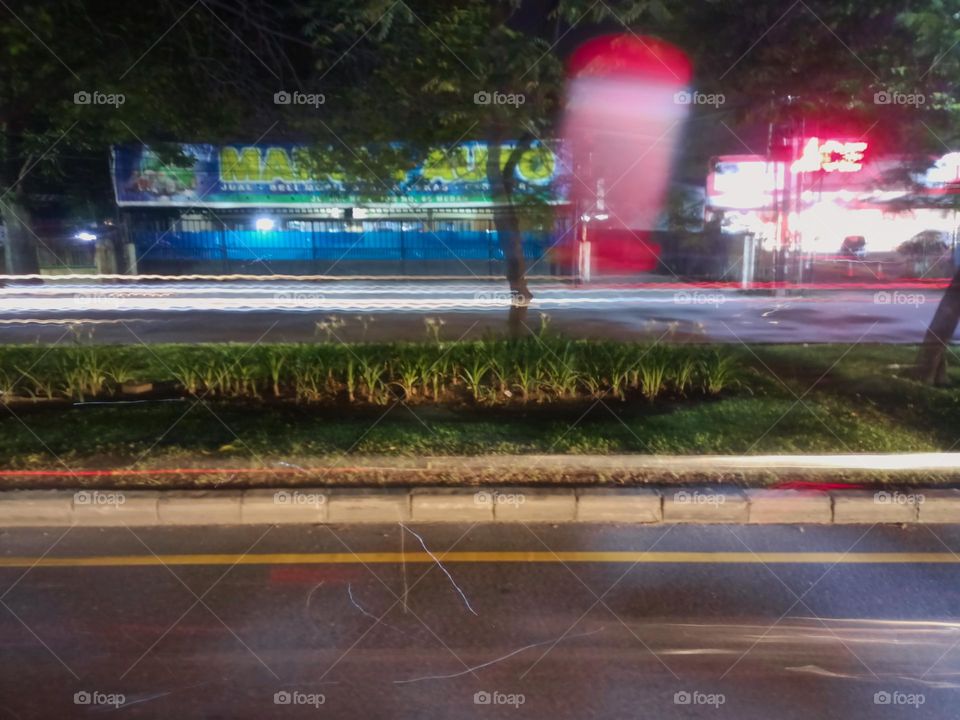 City night lights perspective blurred by high speed of the car. Abstract City night lights. Background and texture.