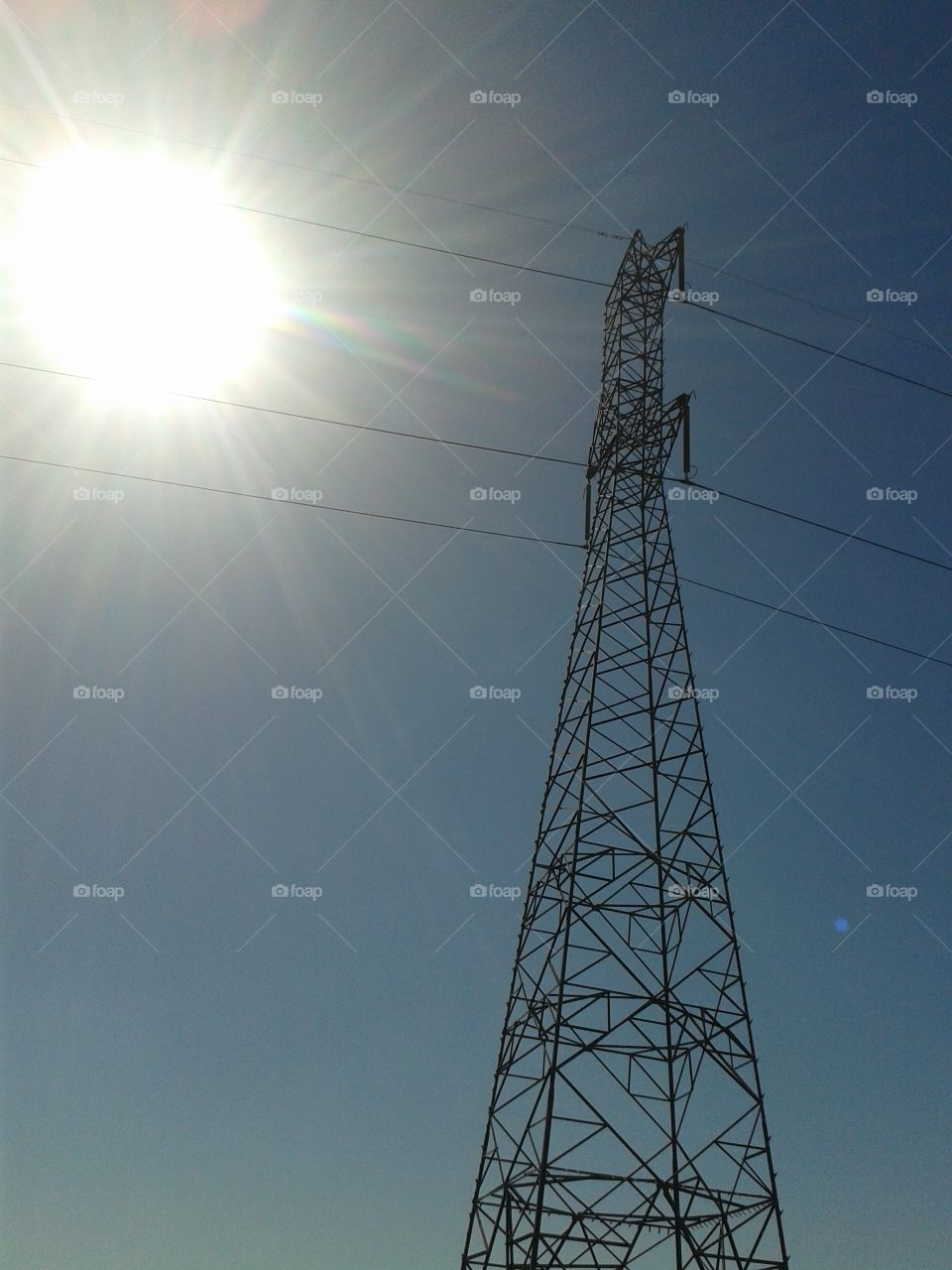 Low angle view of electricity tower