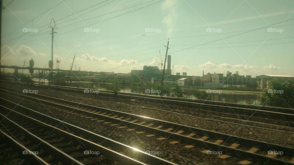 Views of Train Tracks, City Sky and Skyline from Train Window