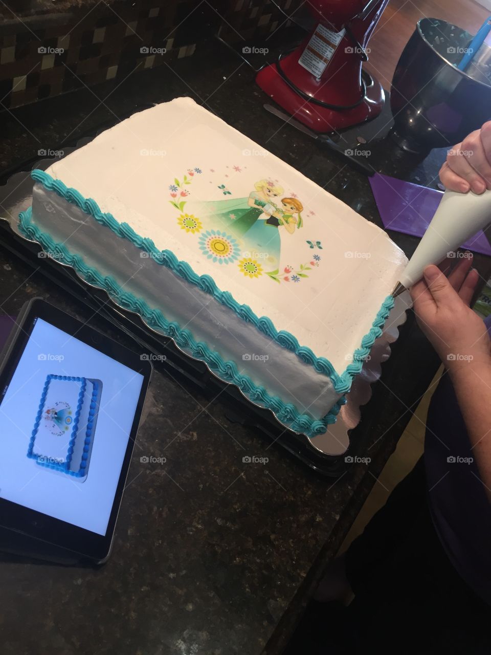 Decorating a birthday cake