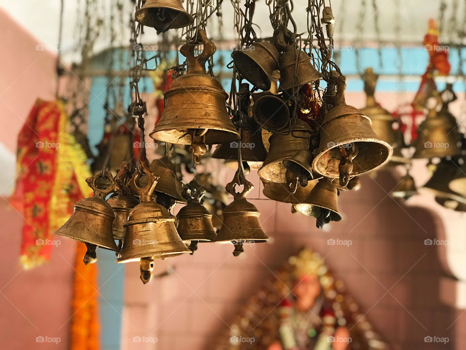 Bells ..  bells are largely used in Indian temple .. when we enter the temple we ring bells and after that we pray to god .AS you can see the MAA Durga in the background 