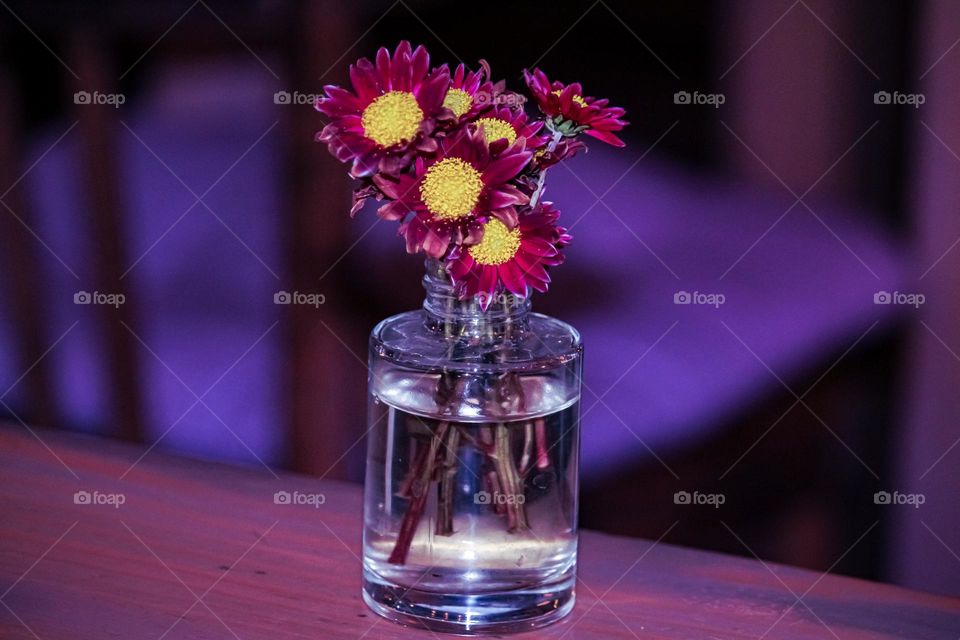 A bouquet of flowers in a bottle