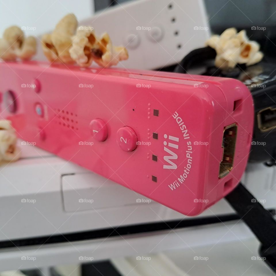Wii controls. pink. popcorn. gaming games