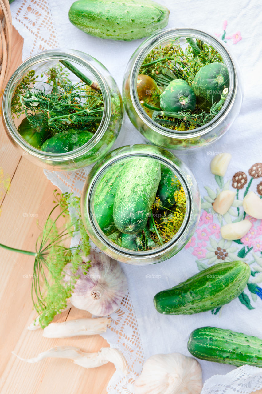 Pickling cucumbers. Pickling cucumbers with home garden vegetables and herbs