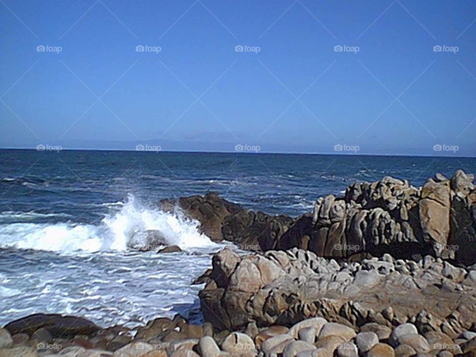 Waves crashing on rocks