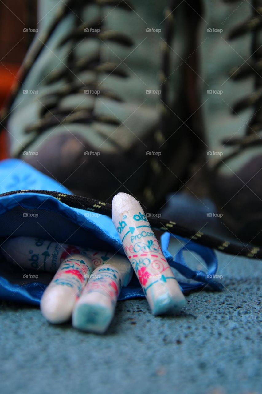 o.b. tampons in blue bag in front of blue walking shoes 