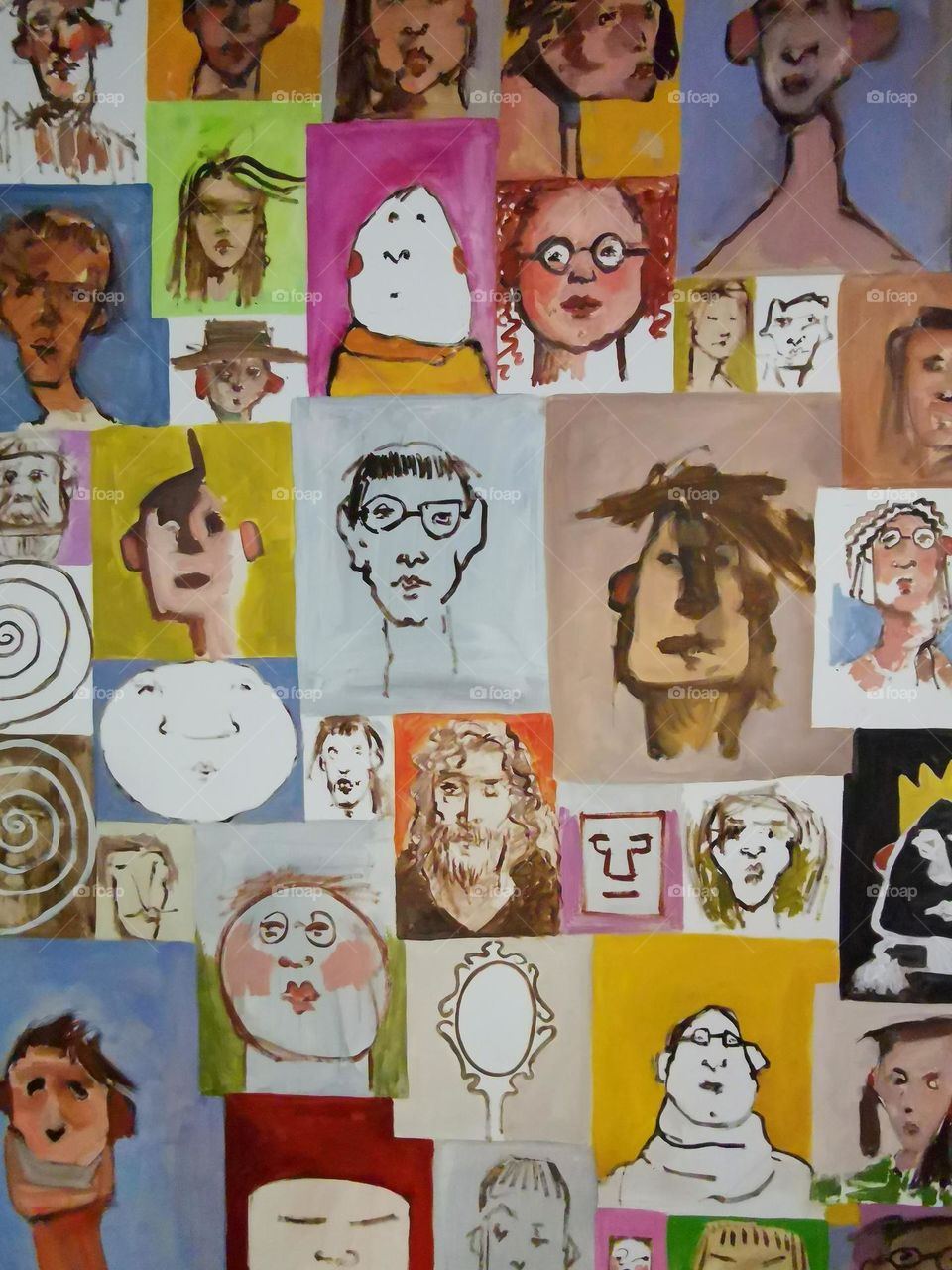 Many children's drawings with portraits of parents.