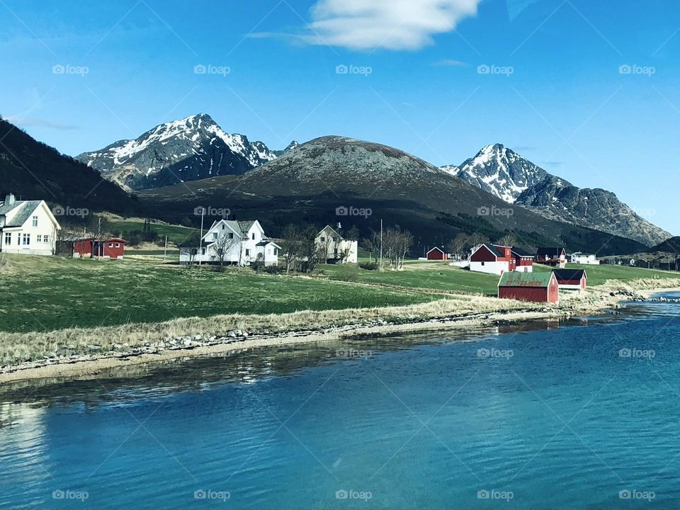 Small red houses by the mountains in Norway