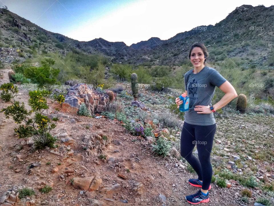 woman on dessert mountain trail