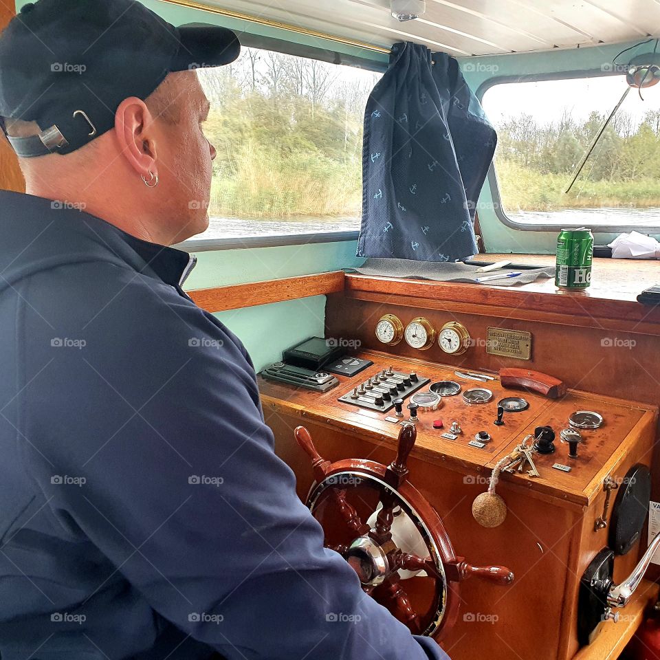 Driving a boat, sailing