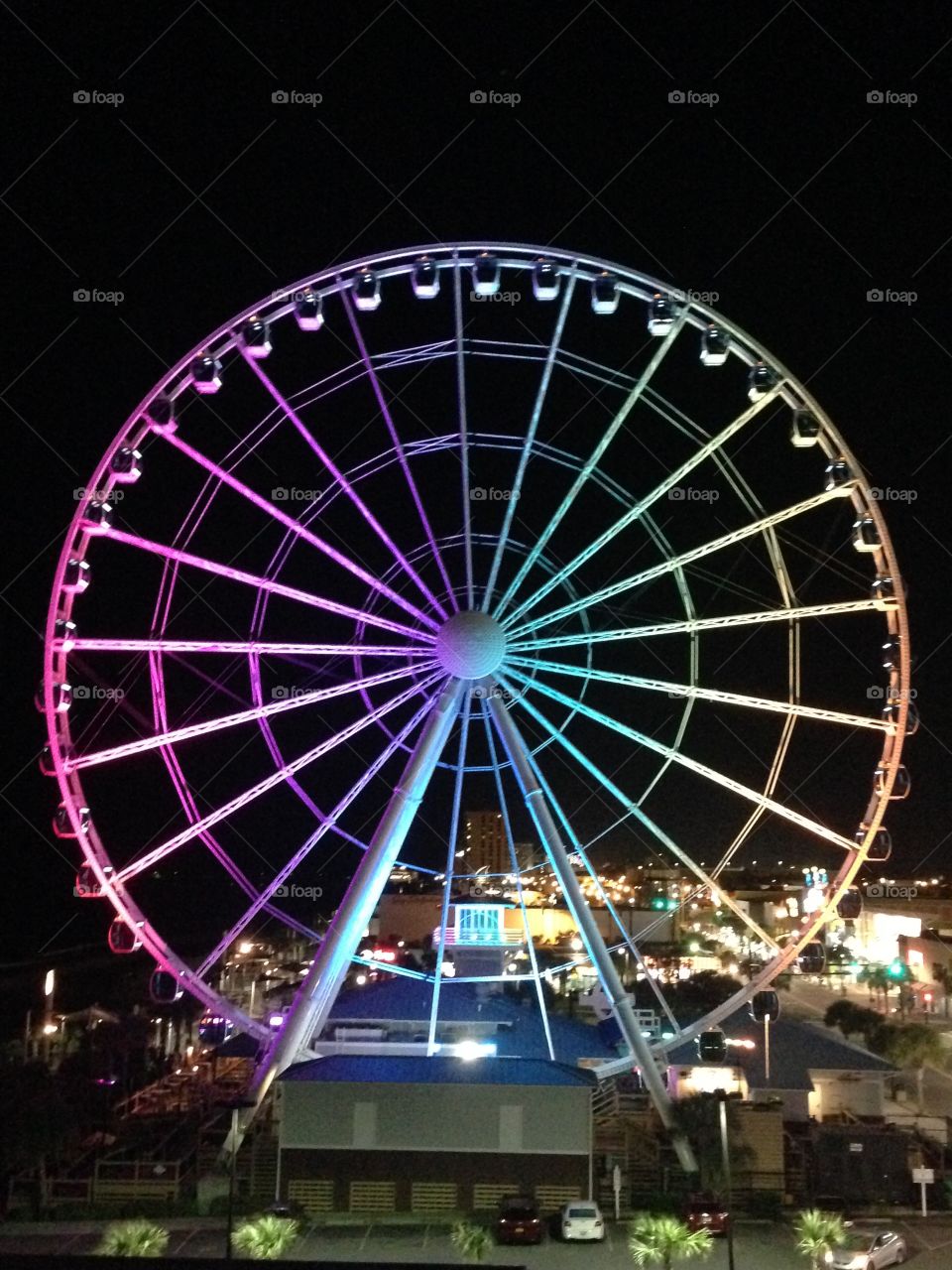 Sky wheel. Myrtle Beach sky wheel on a October night full of color 