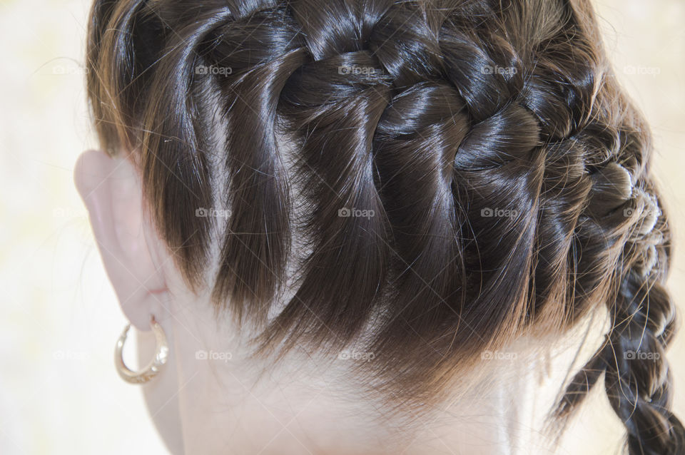 Back view of a close to head woman's braid
