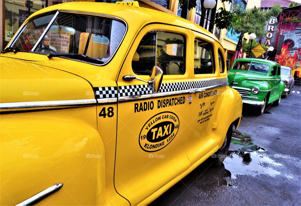 big yellow and green taxi