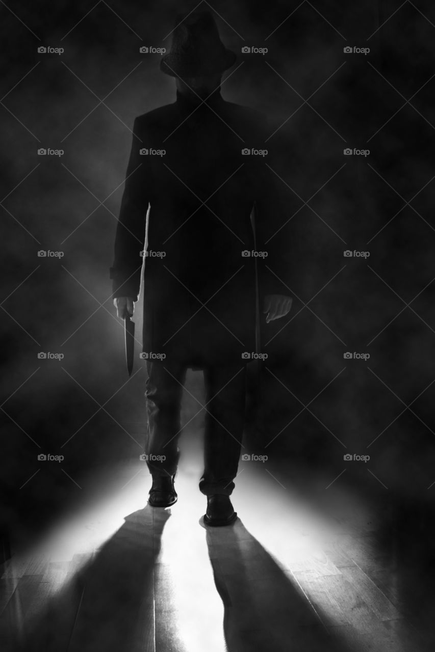 Man in hat with knife