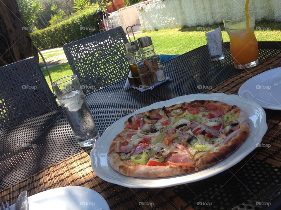 Enjoying a delicious pizza - alfresco!