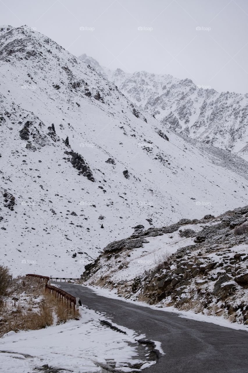 Snow mountain along the way to beautiful blue big Almaty lake in Kazakhstan