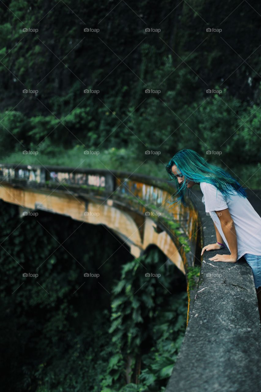 Close-up of woman standing on bridge