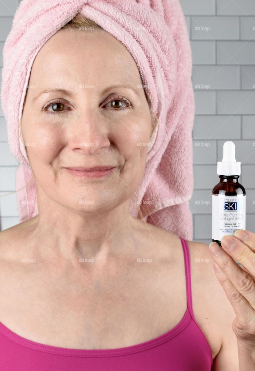 Woman holding a skin product