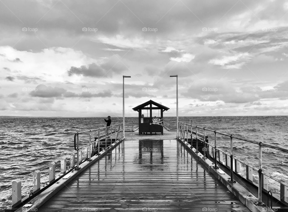 Wild weather at the end of the Mordialloc Pier. Melbourne Victoria Australia 