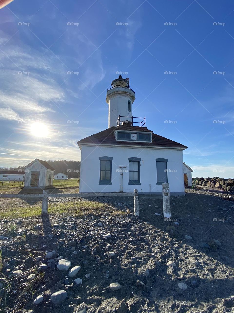 Lighthouse shadow on the beach