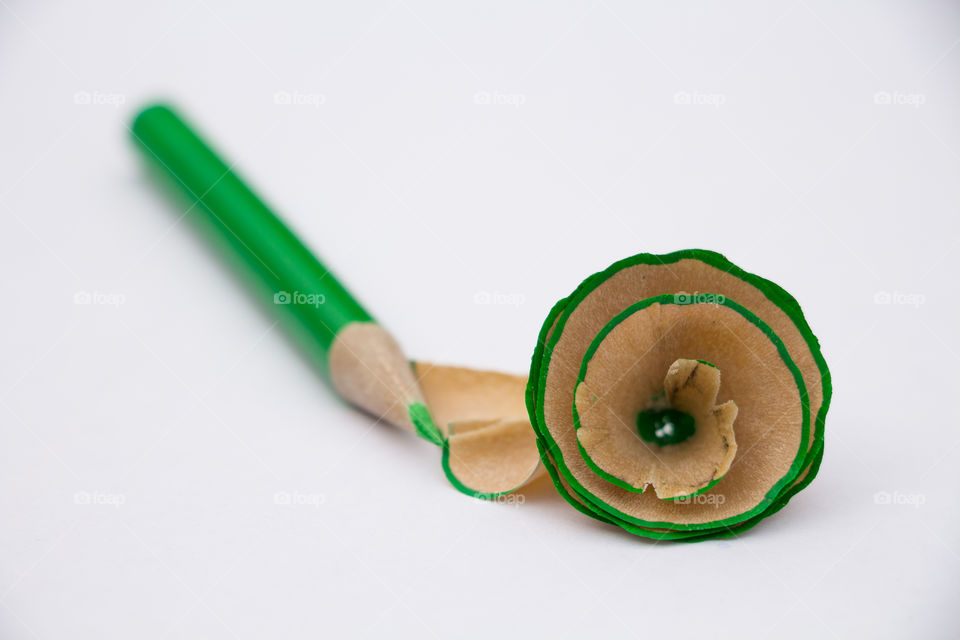 green pencil with rolled chip