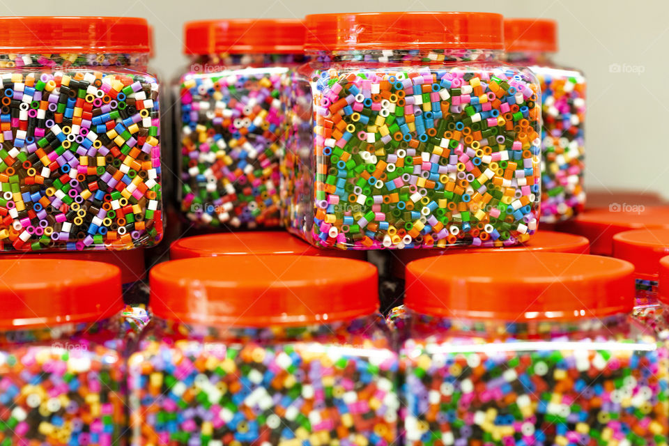 Transparent boxes with colorful details for handicrafts.