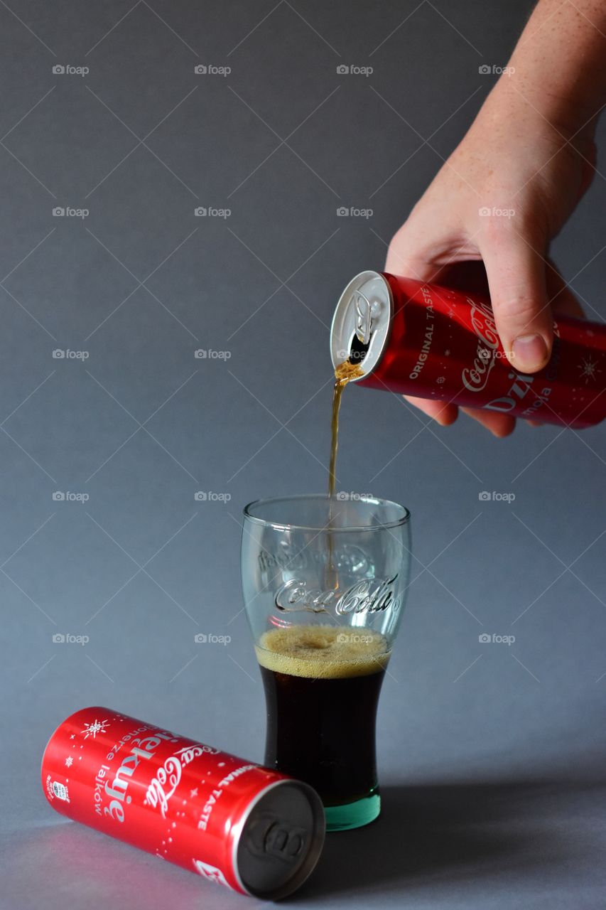 pouring cola in the glass