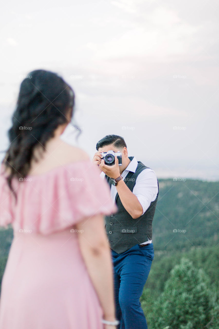 Man taking photos of his fiancé 