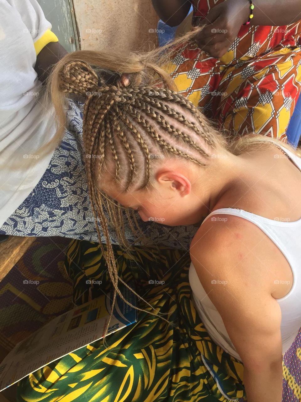 Blond girl going to a saloon to get hair braided