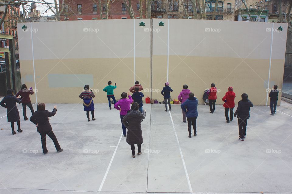 A morning outside dance class on the park handball courts in NYC's Chinatown