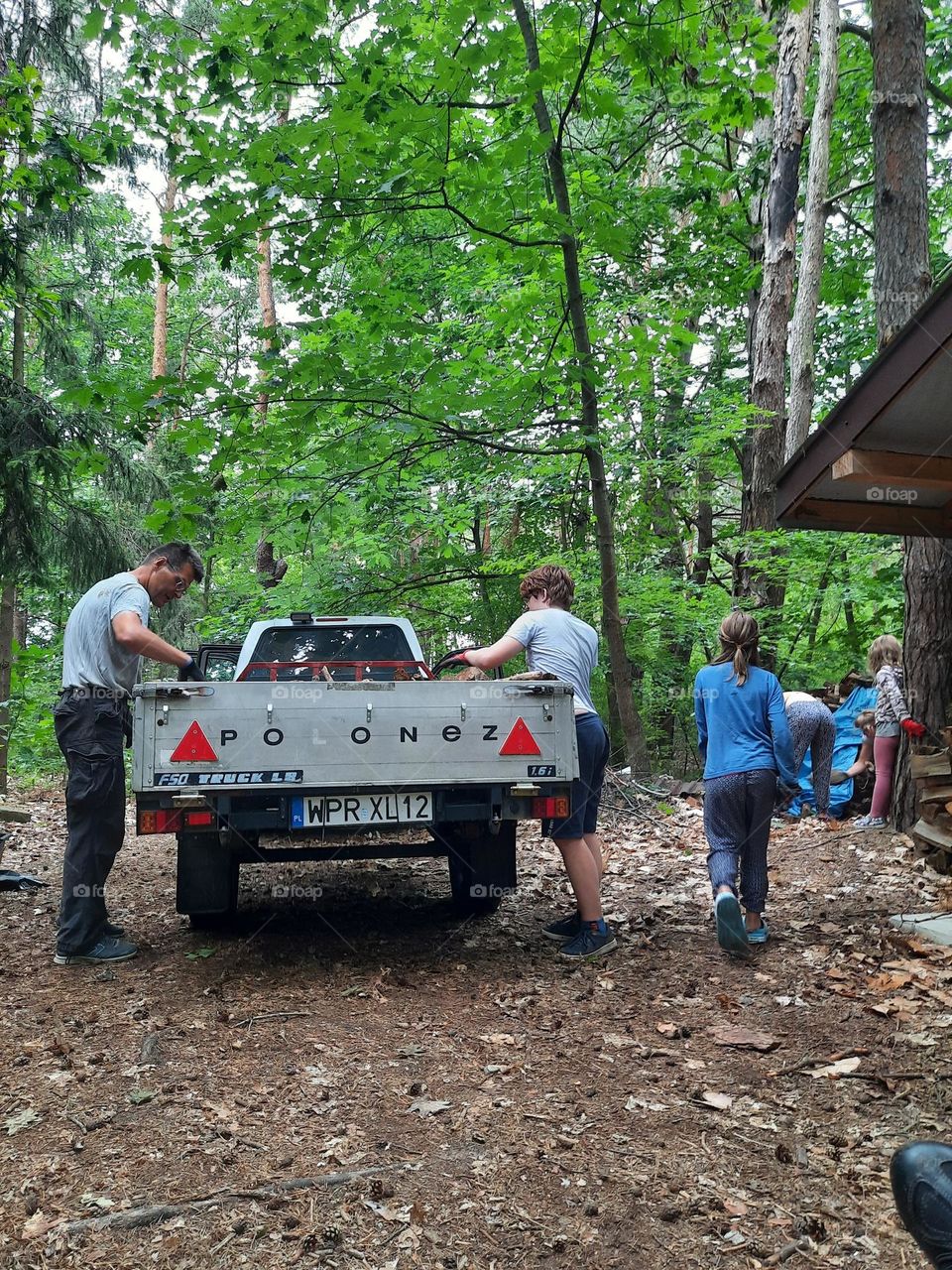 family woking together in forest