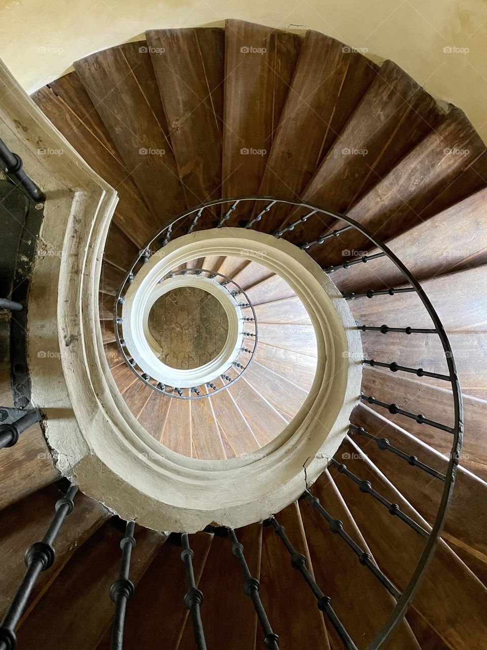 Photo of spiral stairs in the church in Kutná Hora. The stairs go in a spiral.