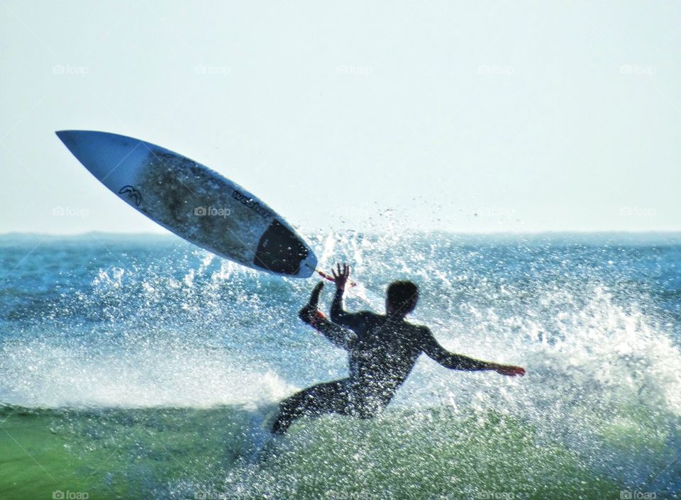 Epic Surfing Wipe Out. Surfer Bailing Off His Board
