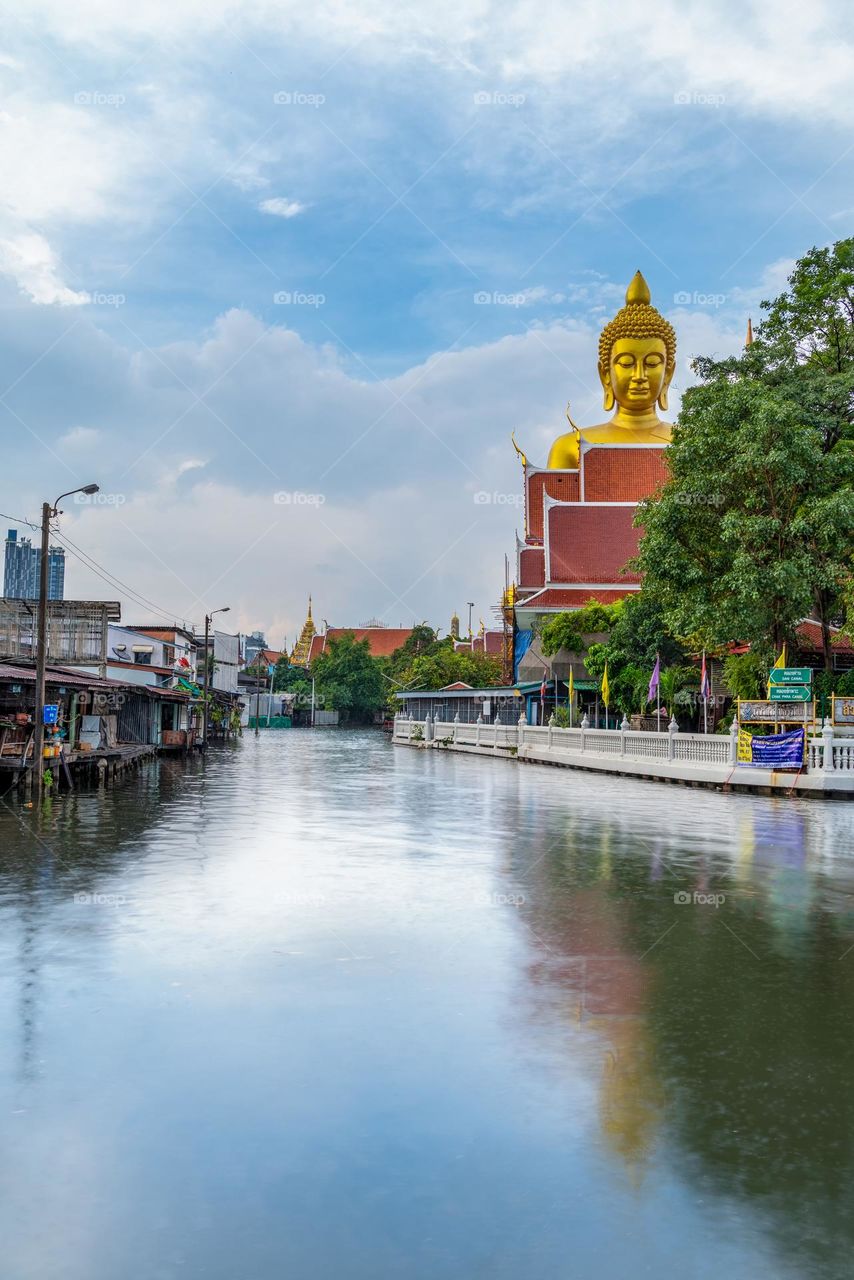 Big Buddha and reflection in river