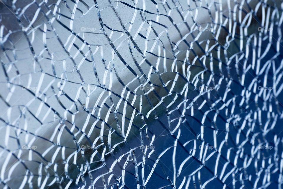 Blue cracked window glass damage situation be careful abstract background