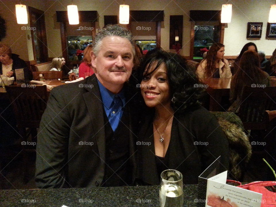 Portrait of a man and woman sitting in restaurant