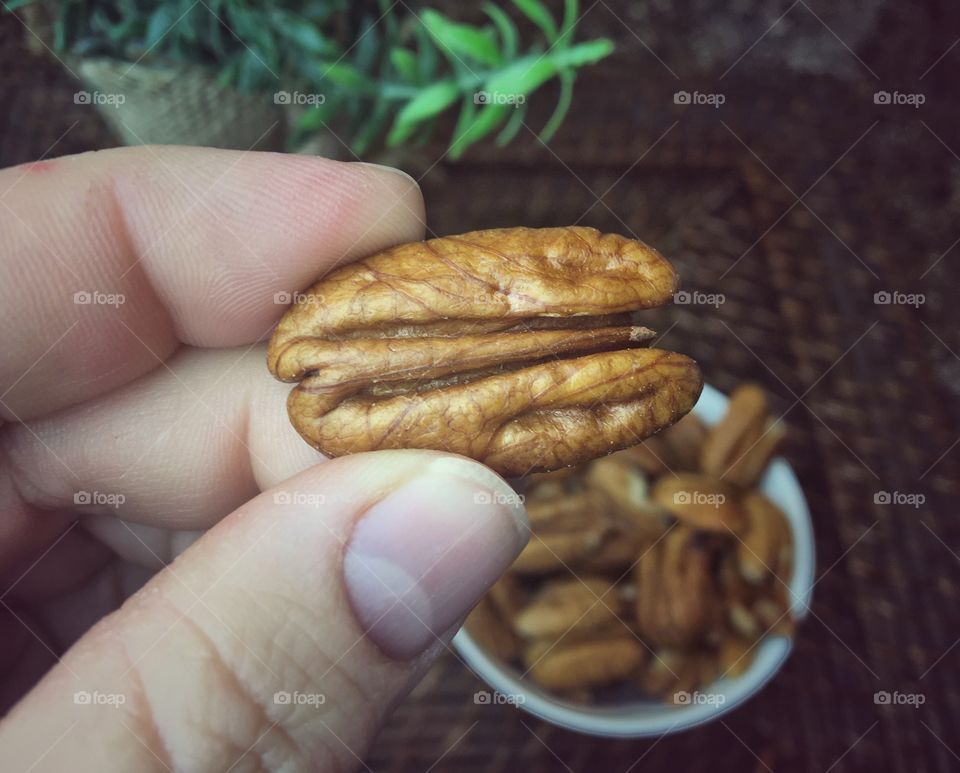 Holding a Pecan