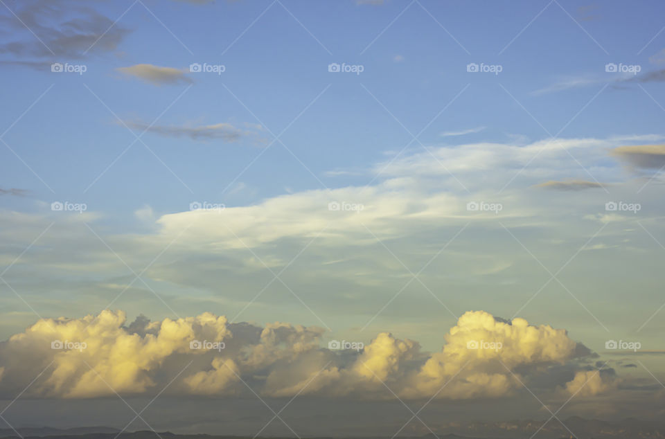 The beauty of the sky with clouds and the sun.