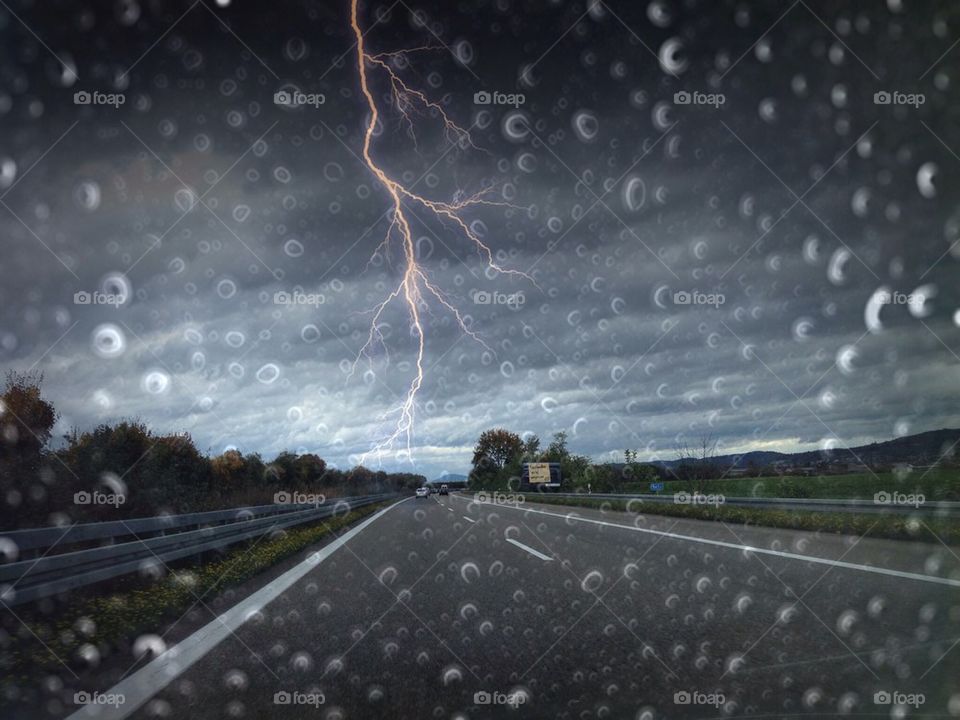 Rain and thunders on highway