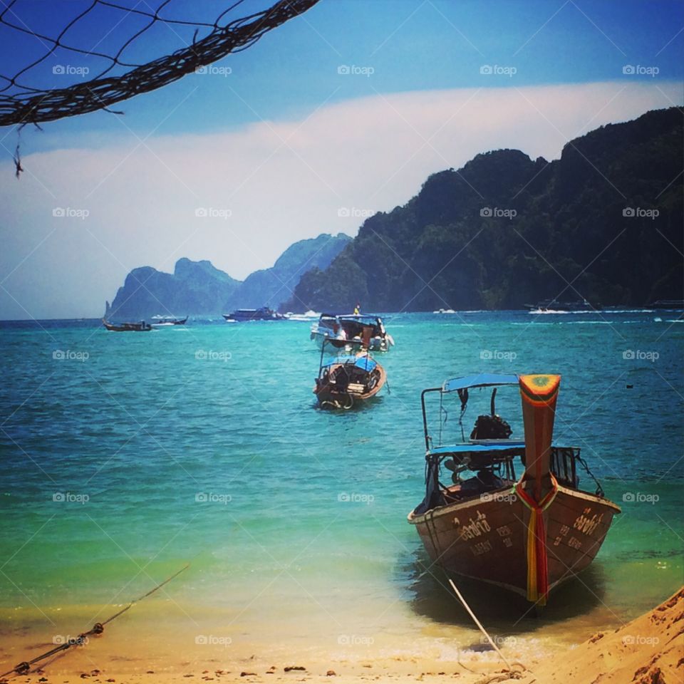 Long boat paradise. Picture of long boats & the harbor on Koh Phi Phi on Thailand. 