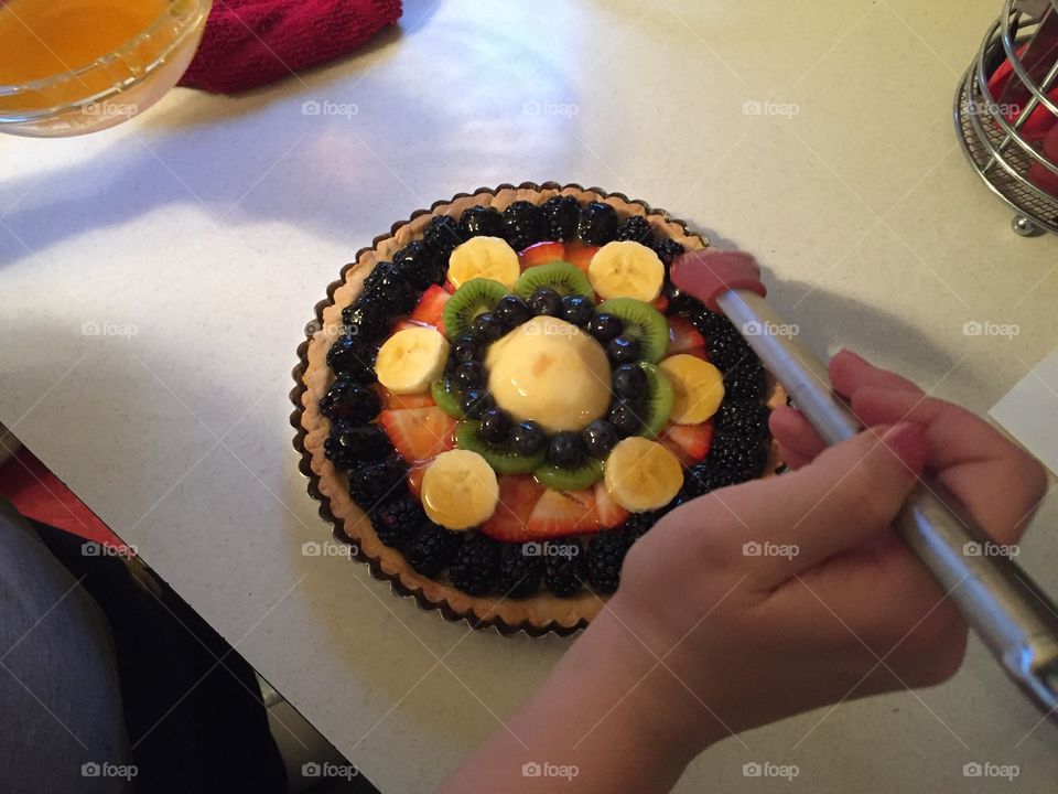 Finishing touches on the fruit tart