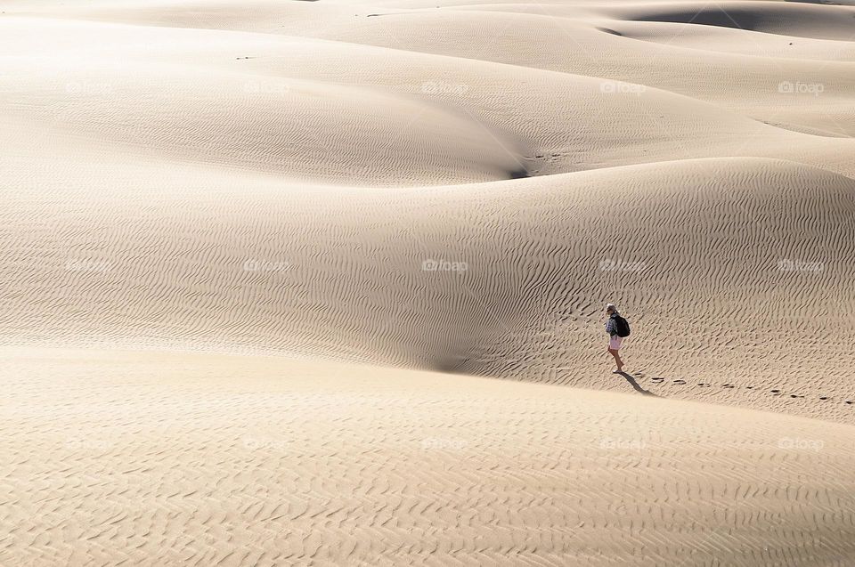 A lonely person in a big desert