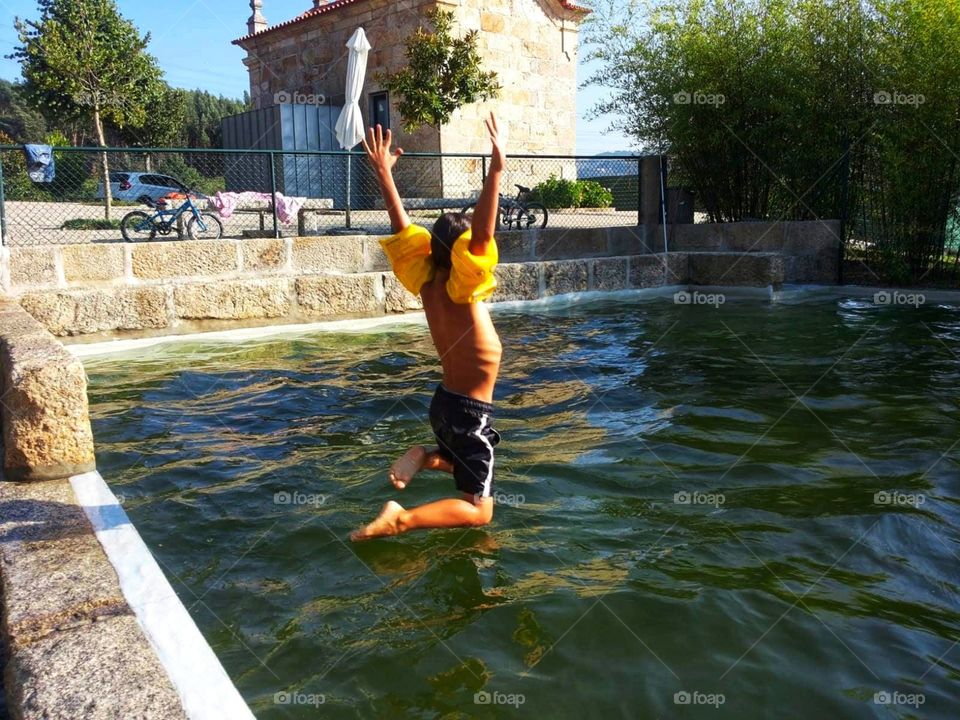 The joy of jumping into the swimming pool