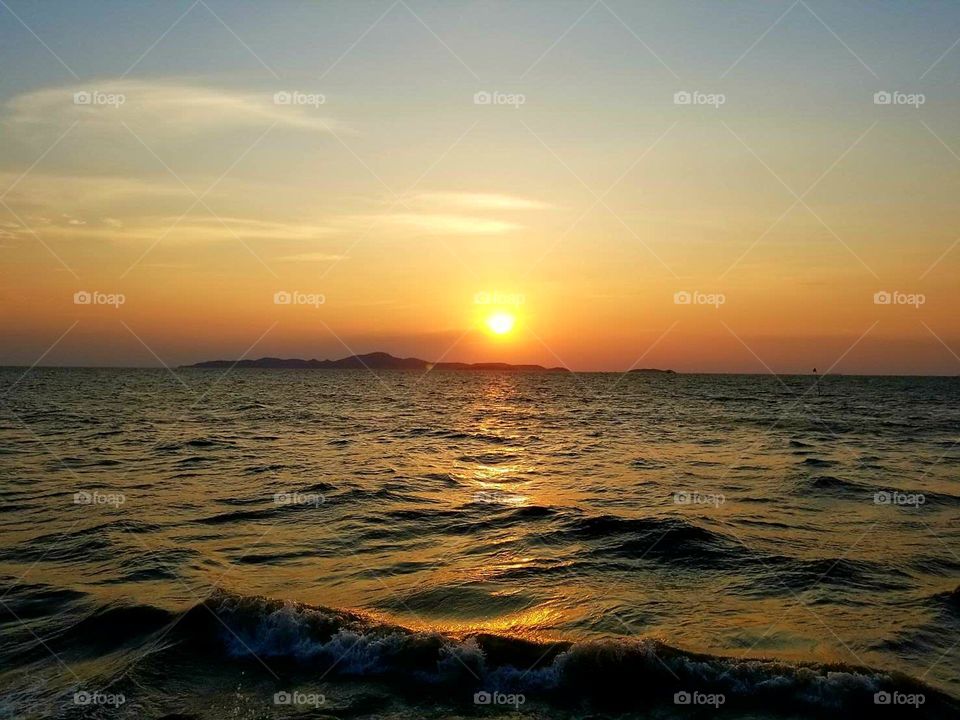 Sunset Over The Waves
